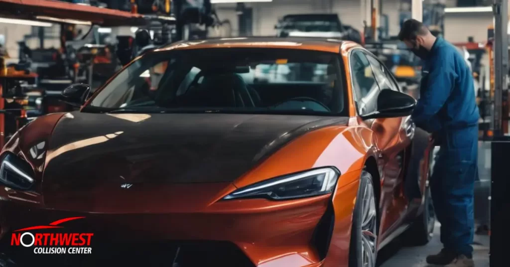 A car being checked by a mechanic in an auto garage